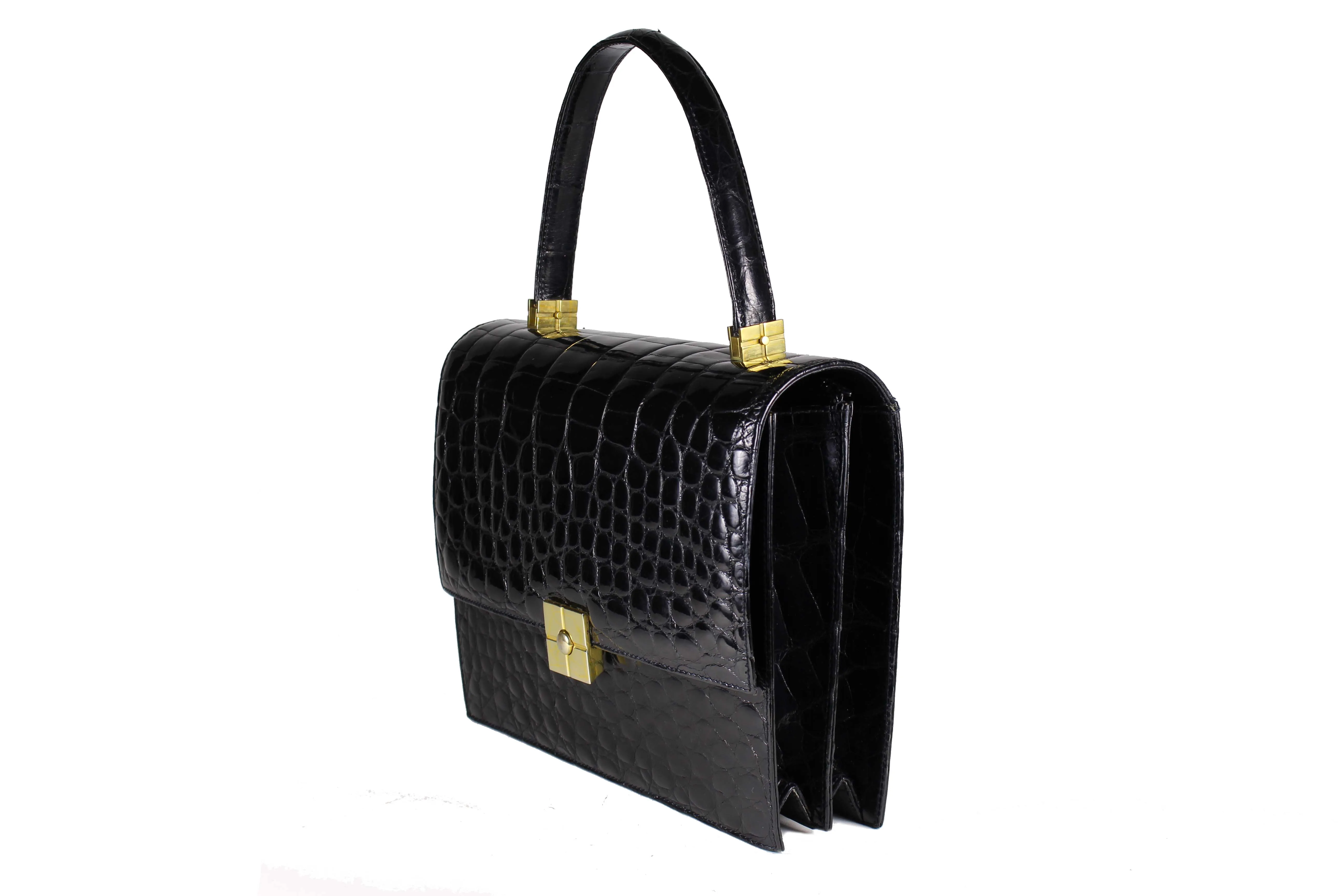 TORRENS jet black crocodile skin handbag with flap and decorative clasp